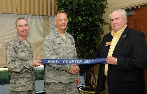 In September, Lt. Col. Trevor Wall, USAF (l), chapter vice president, and Lt. Col. Douglas Short, USAF (c), chapter president, accept the AFCEA Model Chapter Award from Tom Gwaltney, regional vice president.